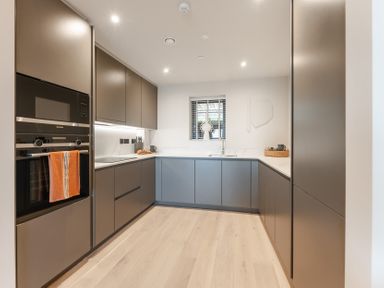 A kitchen with a sink and oven at tbc in St. Ives