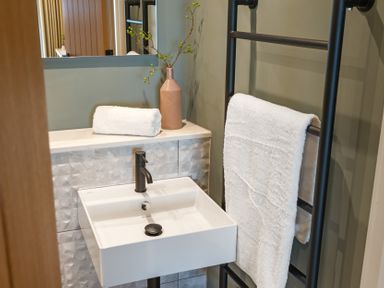 A bathroom with a sink and towel at tbc in St. Ives