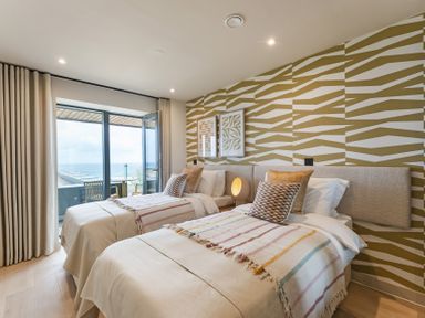 A bedroom with two beds and a view at tbc St. Ives