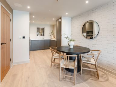 A dining room with a table and chairs at tbc in St. Ives