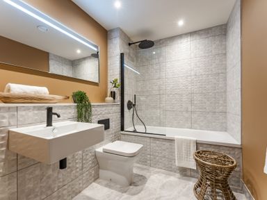 A bathroom with a sink, toilet, and bathtub at tbc in St. Ives