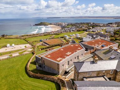A coastal view featuring beach, ocean, and residential areas at tbc in St. Ives