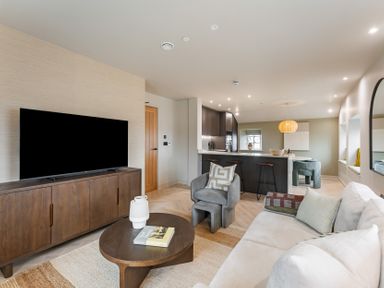 A living room with a television and sofa at tbc St. Ives