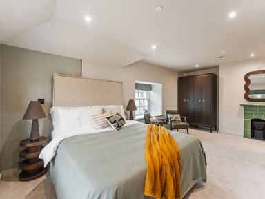 A bedroom with a bed and lamp at tbc in St. Ives