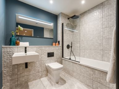 A bathroom with a bathtub and sink at tbc in St. Ives