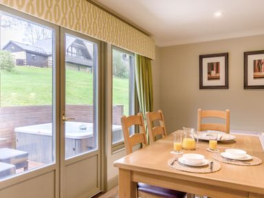 A dining room with a table and glasses at The Derwent Spa (Pet) in Slaley
