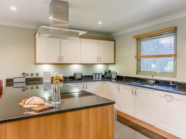 A kitchen with cabinets and countertop at The Derwent Spa (Pet) Slaley