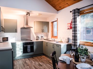 A kitchen with cabinets and a stove at Sidlaw in Fowlis near Dundee