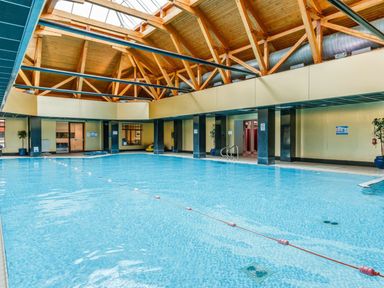 An indoor pool with wooden beams at Sidlaw in Fowlis near Dundee