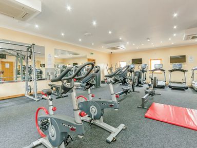 A gym with exercise bikes and treadmills at Sidlaw in Fowlis near Dundee