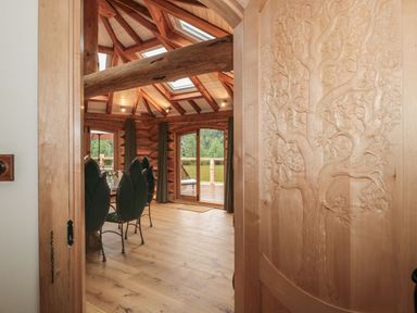 A dining room with a wooden table and chairs at Copper Suite in Chulmleigh