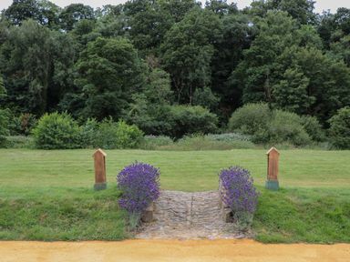 A garden with lavender and a pathway at Copper Suite in Chulmleigh