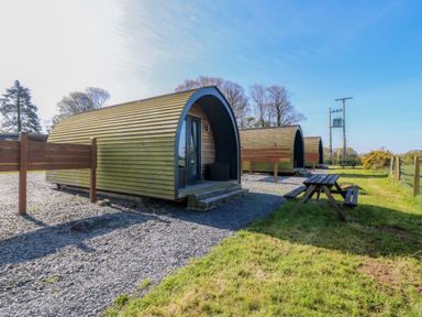Glamping pods with outdoor seating at Bron Eifion Pod 3 Criccieth