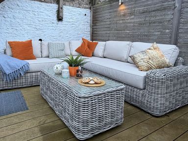 An outdoor seating area with a sofa and coffee table at Dart Views in Dartmouth