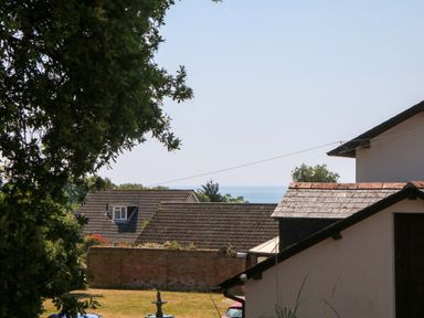 A view of the sea and houses at Gorway Cottage Teignmouth