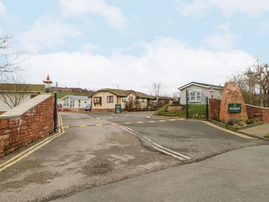 An entrance to a residential park with houses at Heskett in Carlisle