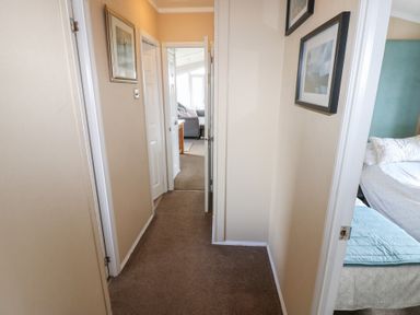 A hallway with doors and frames at Plot 34 near Armathwaite