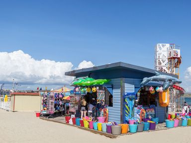 A beach hut selling toys and inflatables at Pixie Cottage in Weymouth