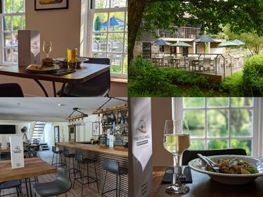 A dining area with tables and food at The Old Mill near Pelynt