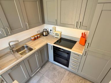 A kitchen with a sink and oven at Charming Barn Annex with Stables New Forest Escape