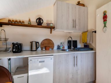 A kitchen area with a sink, kettle, and toaster at Little Linney Sleeps 2 Garden  Parking  Wifi in Hartland