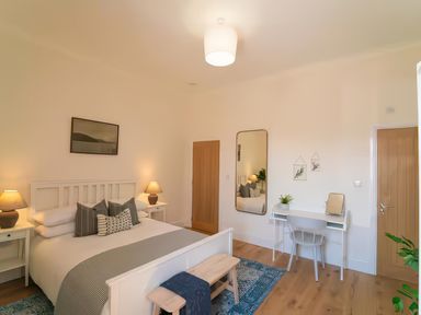 A bedroom with a bed and a desk at Foundry Farm Apartment in 
