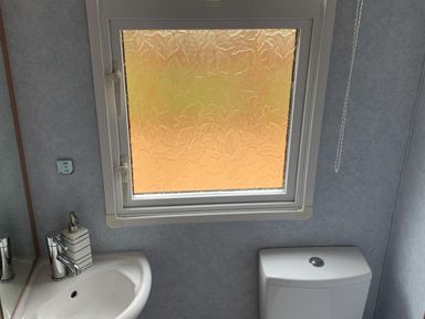 A bathroom with a sink and toilet at Static Caravan  2 Bedrooms  - sleeps 4, Hawick