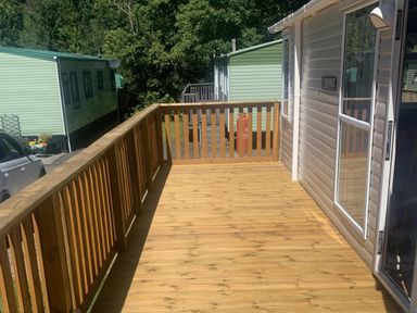 A deck area with wooden flooring at Static Caravan 2 Bedrooms - sleeps 4 in Hawick