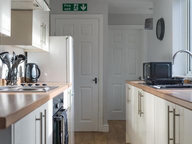 A kitchen with appliances and countertops at Lily Apartment - Sleeps 3 - Pet friendly - Parking Bedlington