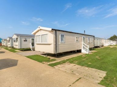 A caravan situated on a pathway at Tide’s Reach - Hayling Island