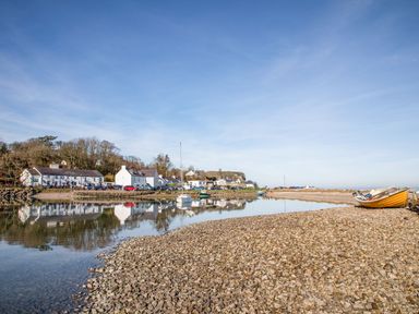 A coastal view with houses and boats at Bryn Llifon in Pentraeth