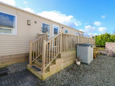 An outdoor area with steps and a shed at Plot 41 High Hesket near Armathwaite