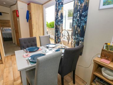 A dining room with a table set for dinner at Plot 41 High Hesket near Armathwaite