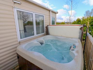 A hot tub with water in an outdoor area at Plot 41 High Hesket near Armathwaite