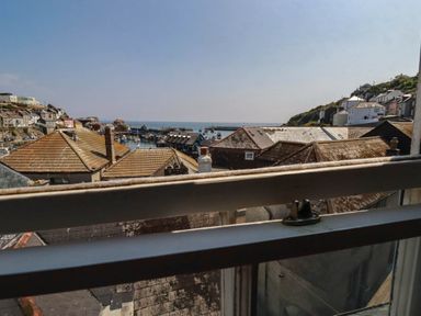 An outdoor view of boats in a harbor at Stones Throw in Mevagissey