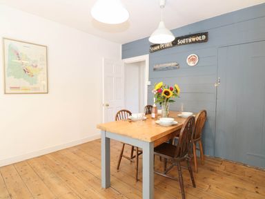 A dining room with a table and chairs at 19 Covert Road in Reydon