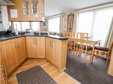 A kitchen with a dining area in Winchester - 478 Abergele