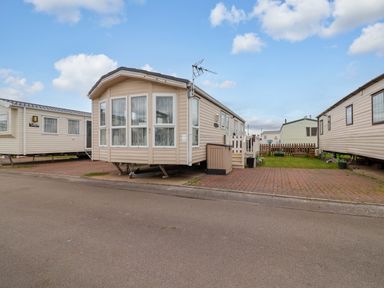 A mobile home on a driveway in an outdoor area at Winchester - 478 Abergele