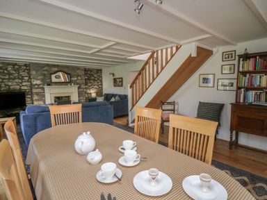 A dining room with a table set for tea at Tegfan in Newport