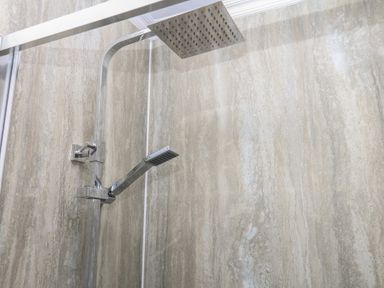 A shower installation with a shower head and handle at The White House in Okehampton