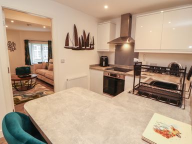 A kitchen with appliances and a counter at Hidden Gem in 
