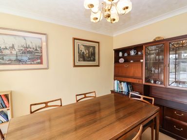 A dining room with a table and chairs at Number 10, Broadway