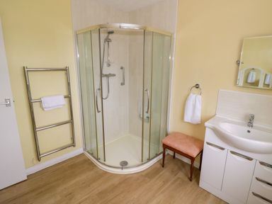 A bathroom featuring a shower and washbasin at Number 10, Broadway