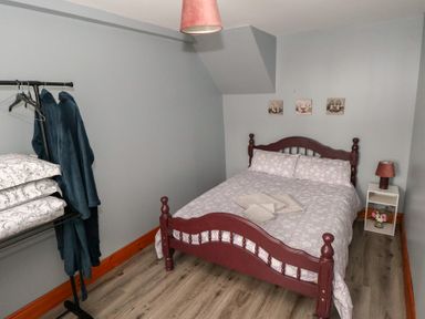 A bedroom with a bed and bedside table at Ti Maolla in Hollymount