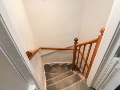A staircase with handrail at 15D Foss Street Dartmouth