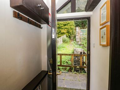 An entrance with a door and coat hooks at Dunmail Raise, Grasmere Lodge