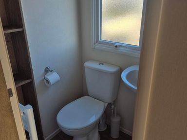 A bathroom with a toilet and sink at Unity Beach - Abi Ryedale Burnham-on-Sea