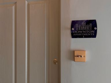 A door with a nameplate at Downton Apartments I in Alnwick