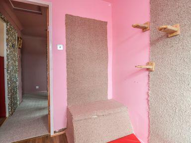 A room with a door and carpeted floor at Hafan Deg in Holywell