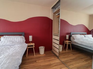 A bedroom with a bed and a nightstand at Hafan Deg in Holywell